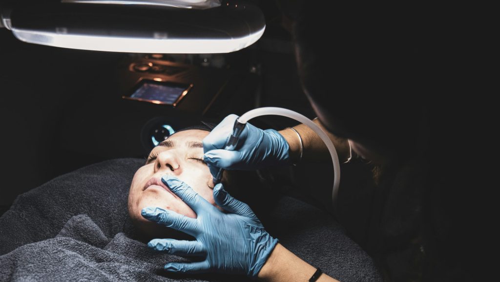 person fixing someone's face