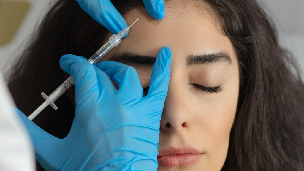 Botox injection being administered to a woman.
